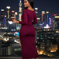 slanted view of Burgundy ruched bodycon midi dress with elegant boat neckline